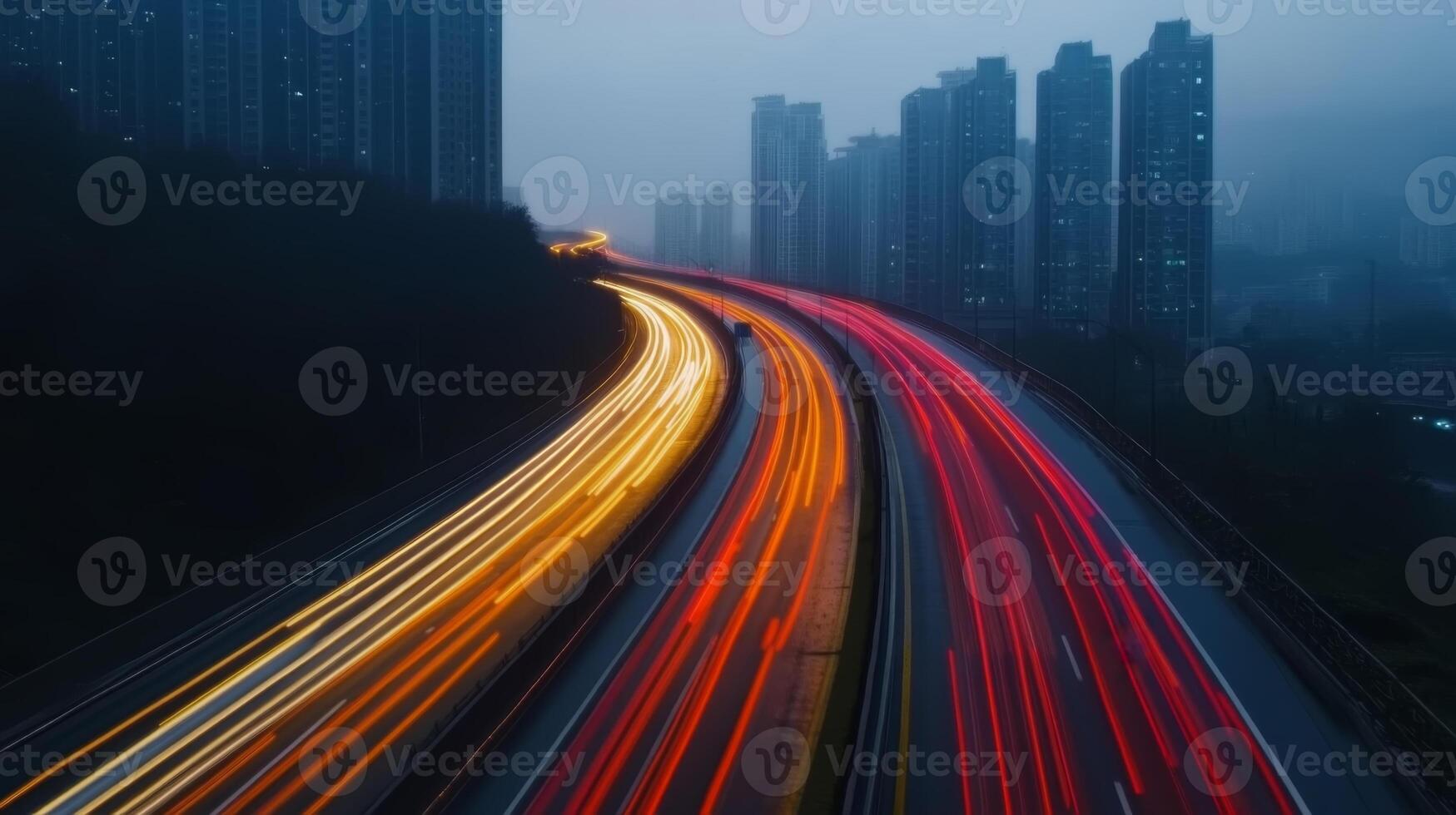 Traffic light trails create a striking urban landscape at dusk near tall buildings in a bustling city photo