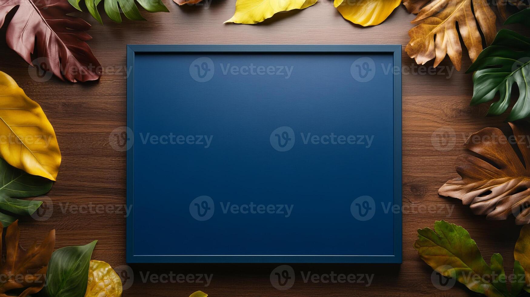 Elegant blue background surrounded by vivid tropical leaves ideal for creative presentations and design projects photo