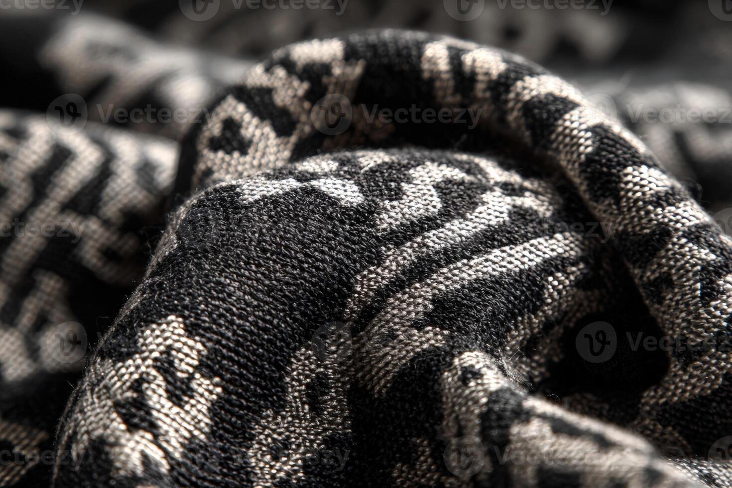 Elegant jacquard textile with geometric patterns in black and silver showcasing intricate design and texture photo