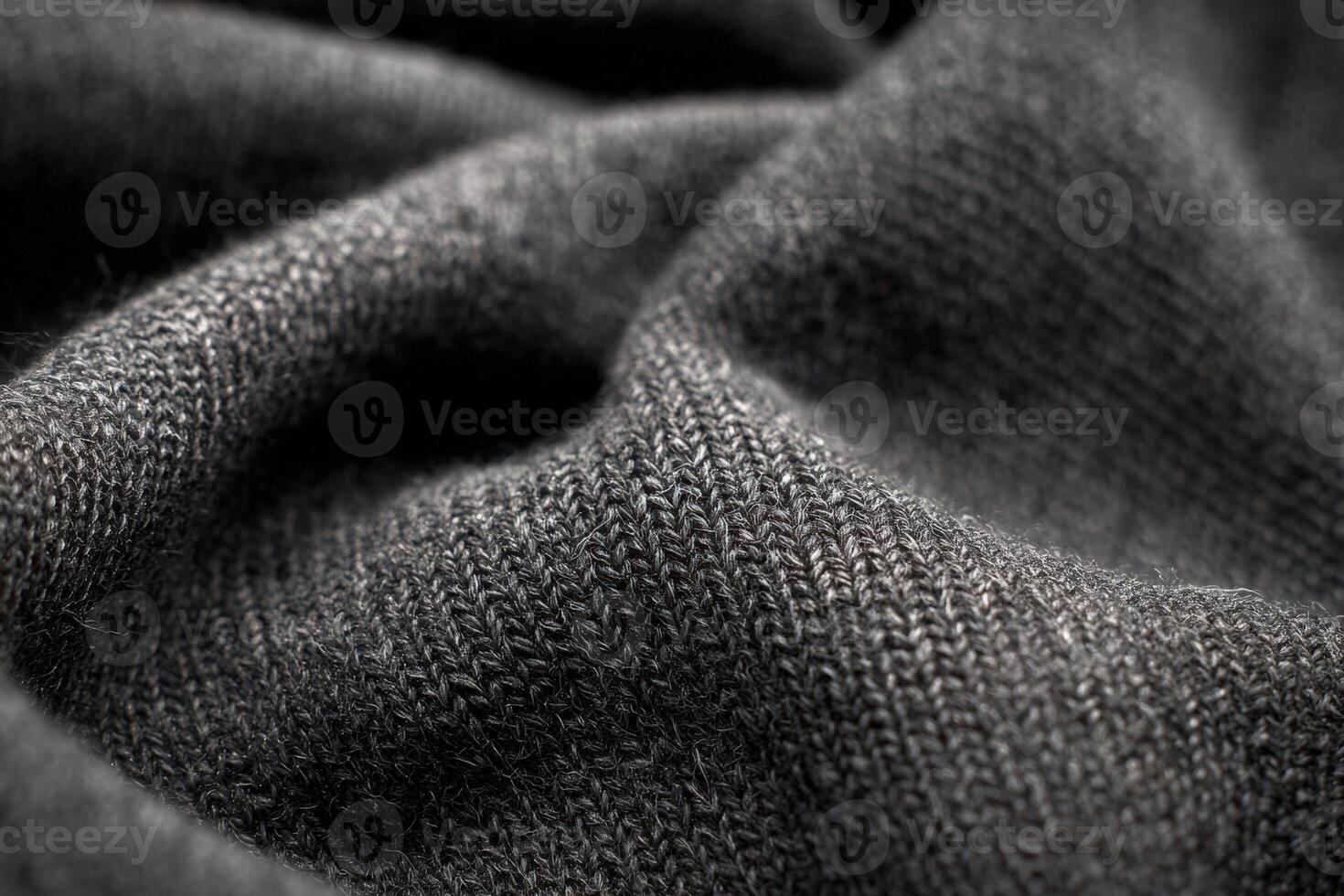 Close up of soft merino wool fabric in rich charcoal gray showcasing texture and quality for diverse textile applications photo
