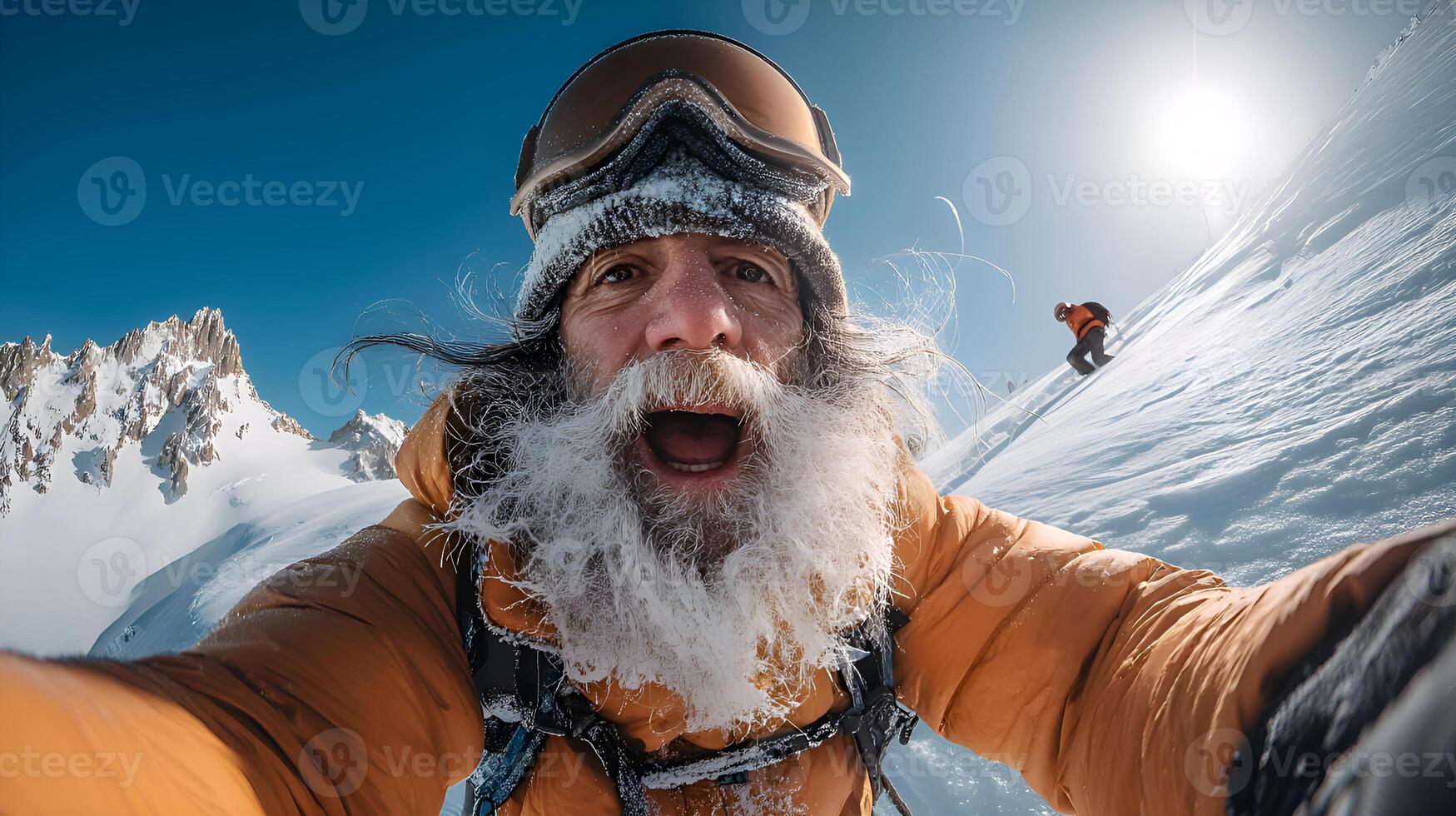 Excited snowboarder taking selfie on mountain top with frozen beard photo