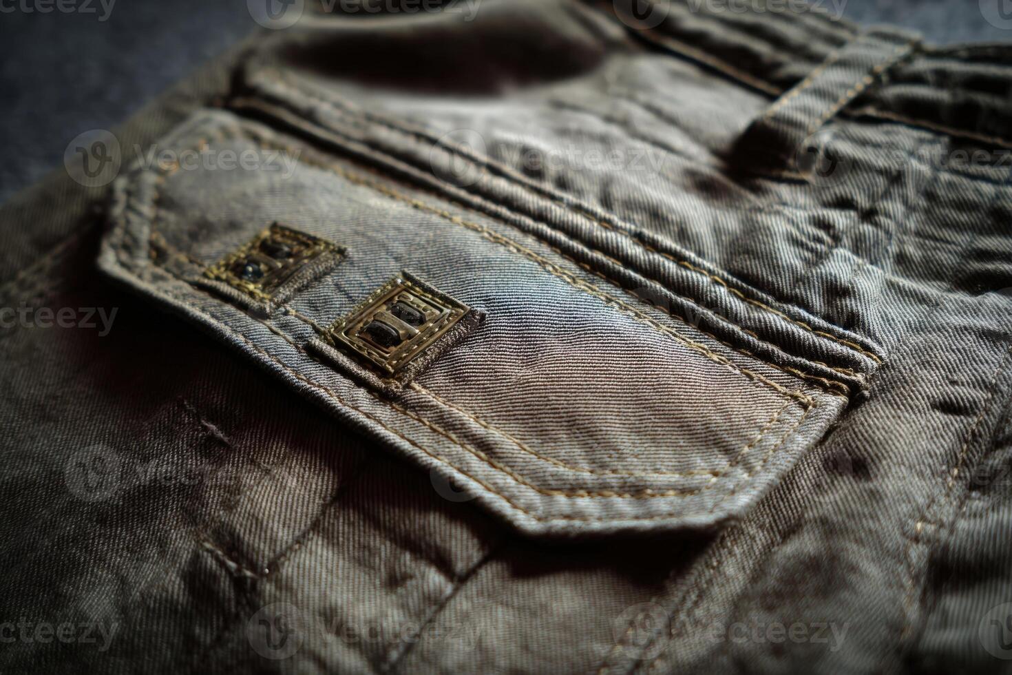 Close up of bar tack reinforcement stitching on fabric swatch showcasing detailed craftsmanship and textile durability photo