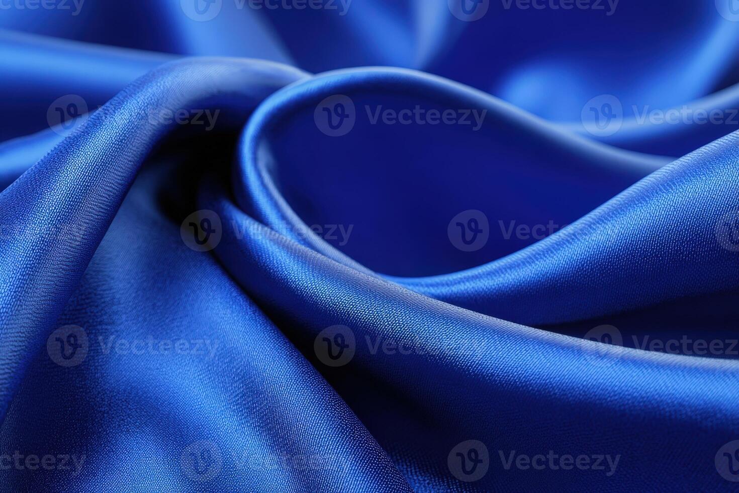 Close up view of smooth blue satin fabric highlighting texture and elegance in soft light photo