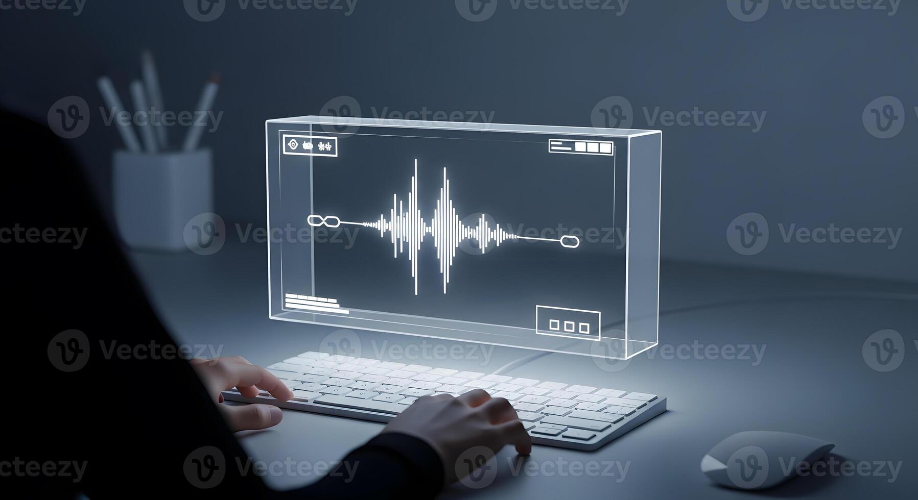 A person typing on a computer with a sound wave on the screen photo