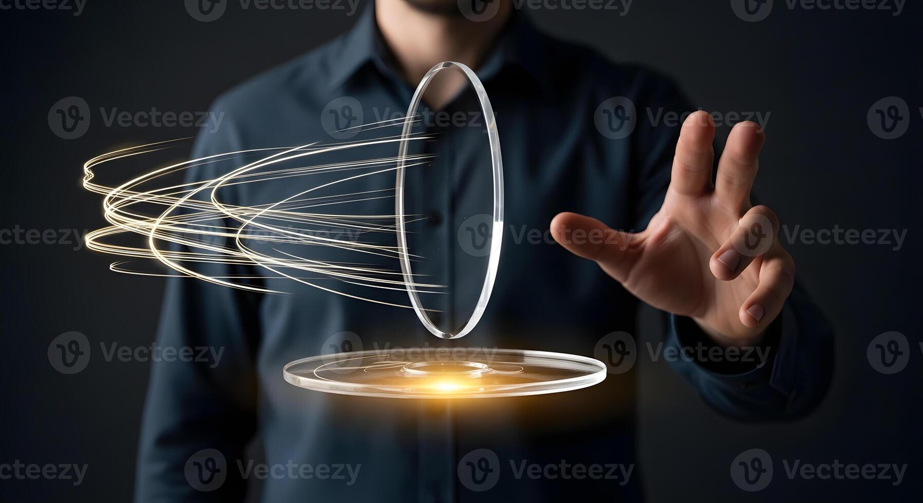 A man is holding a transparent object with a glowing light photo