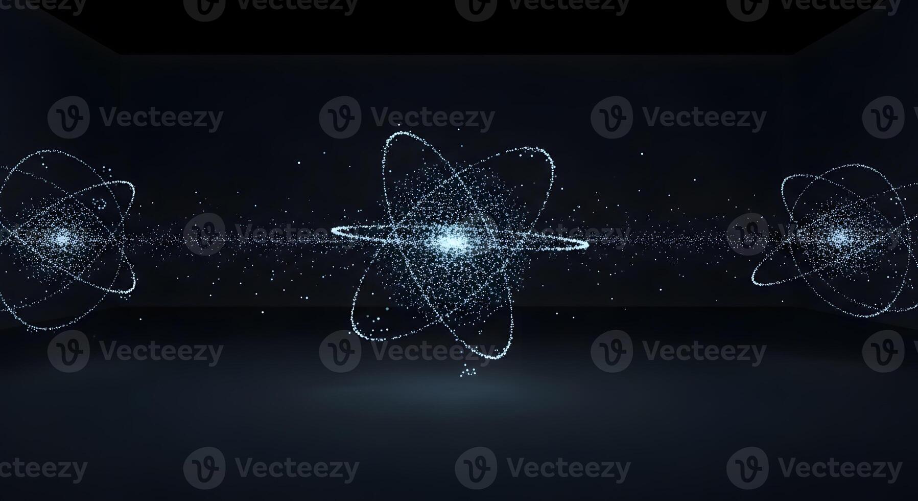 Three atomic rings are shown in a dark room photo