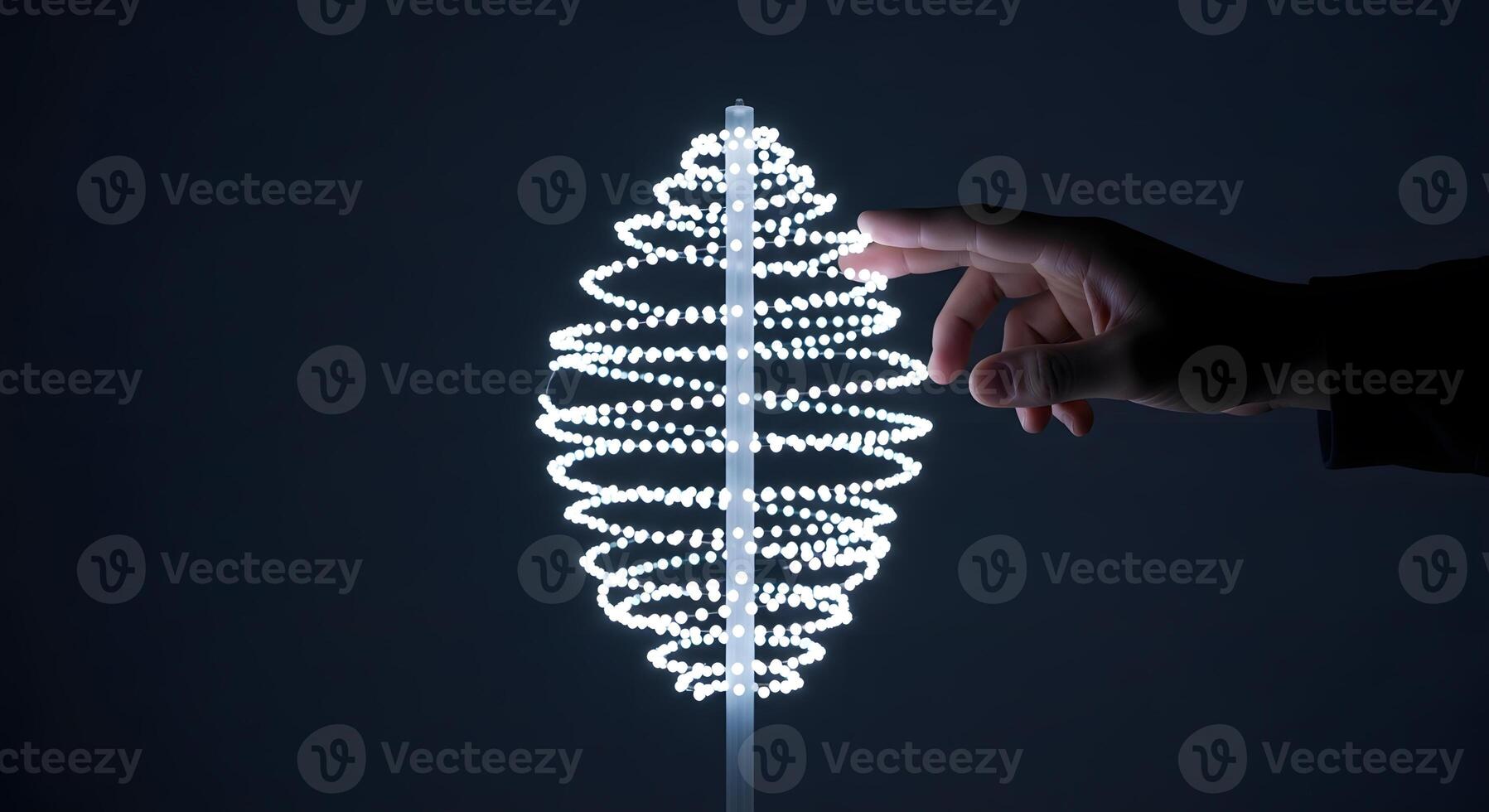 A person holding a lighted spiral object photo