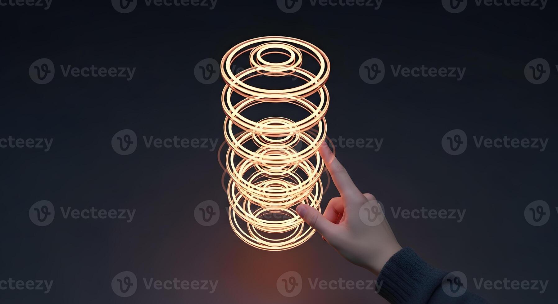 A person holding up a lighted spiral photo