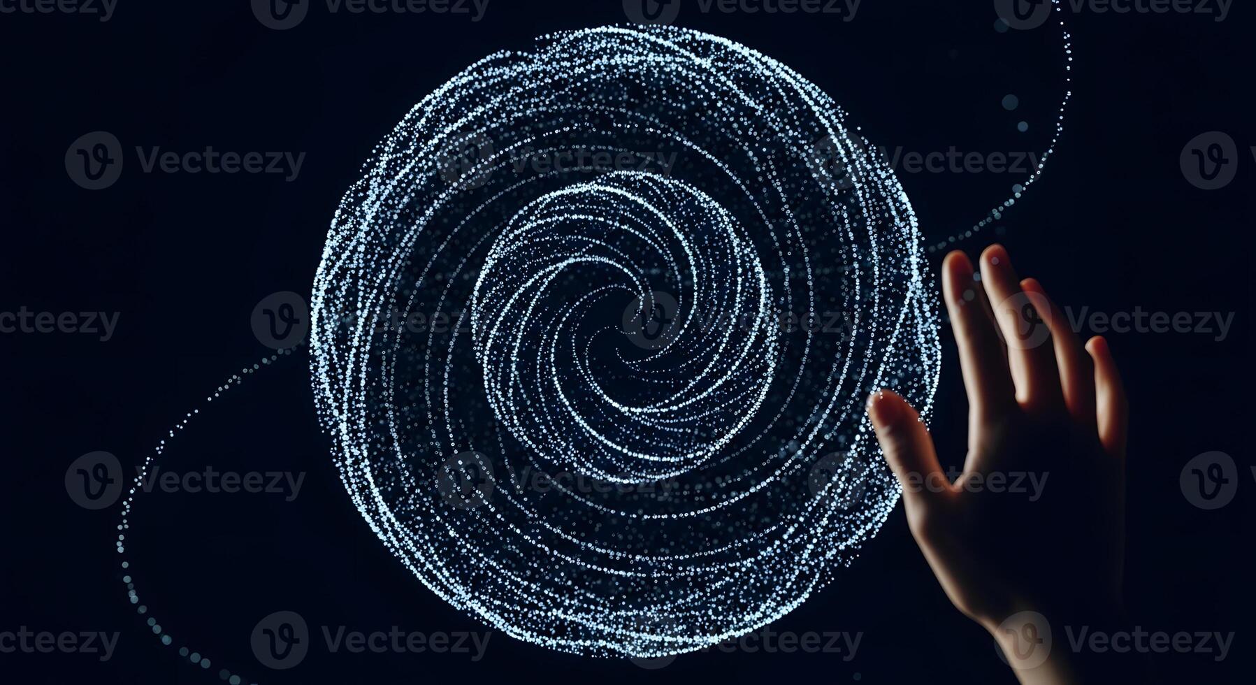 A person's hand is touching a circular object photo