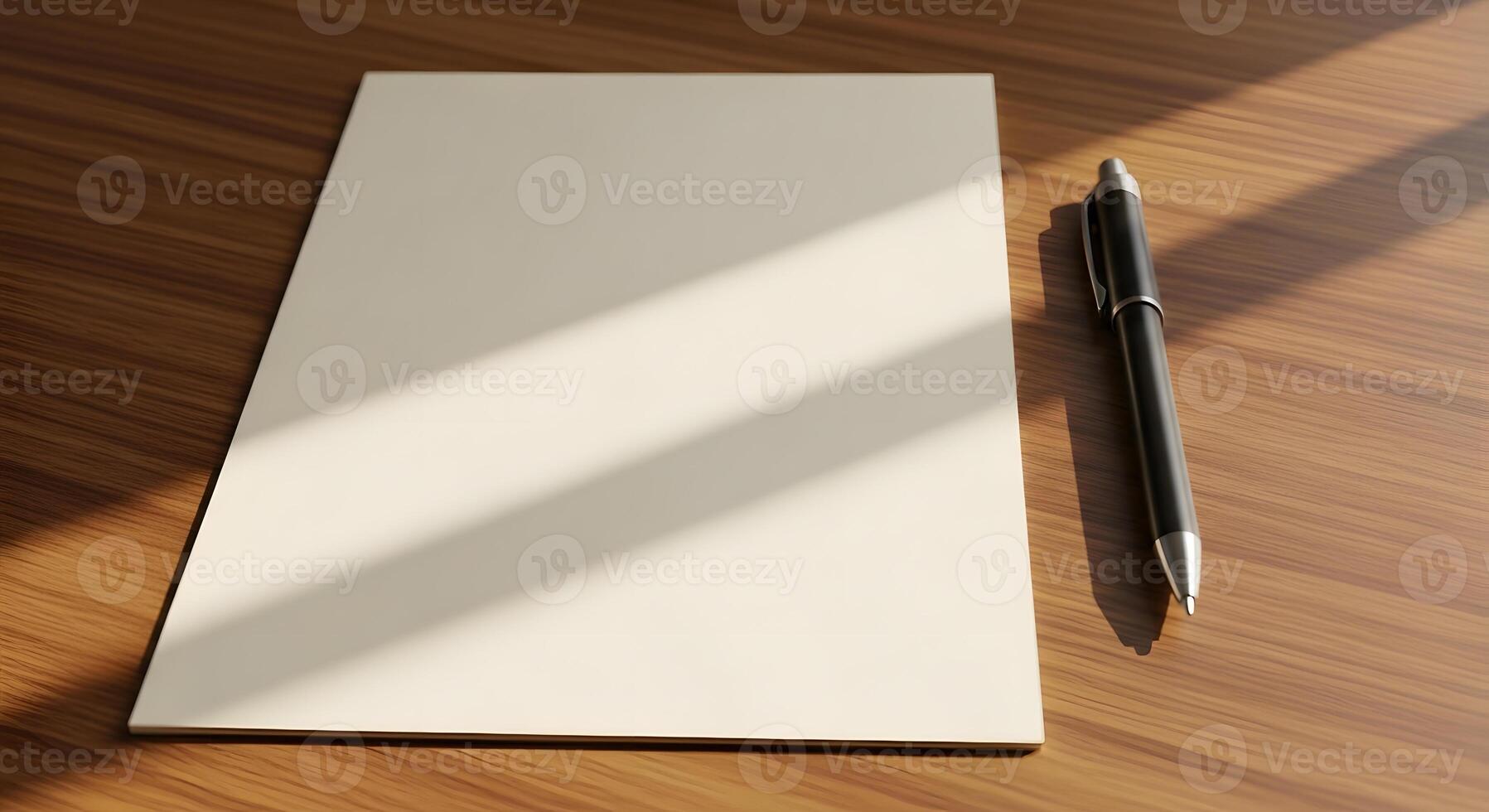 A notepad and pen on a wooden table photo