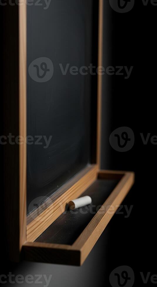 A blackboard with a pencil on it in front of a blackboard photo