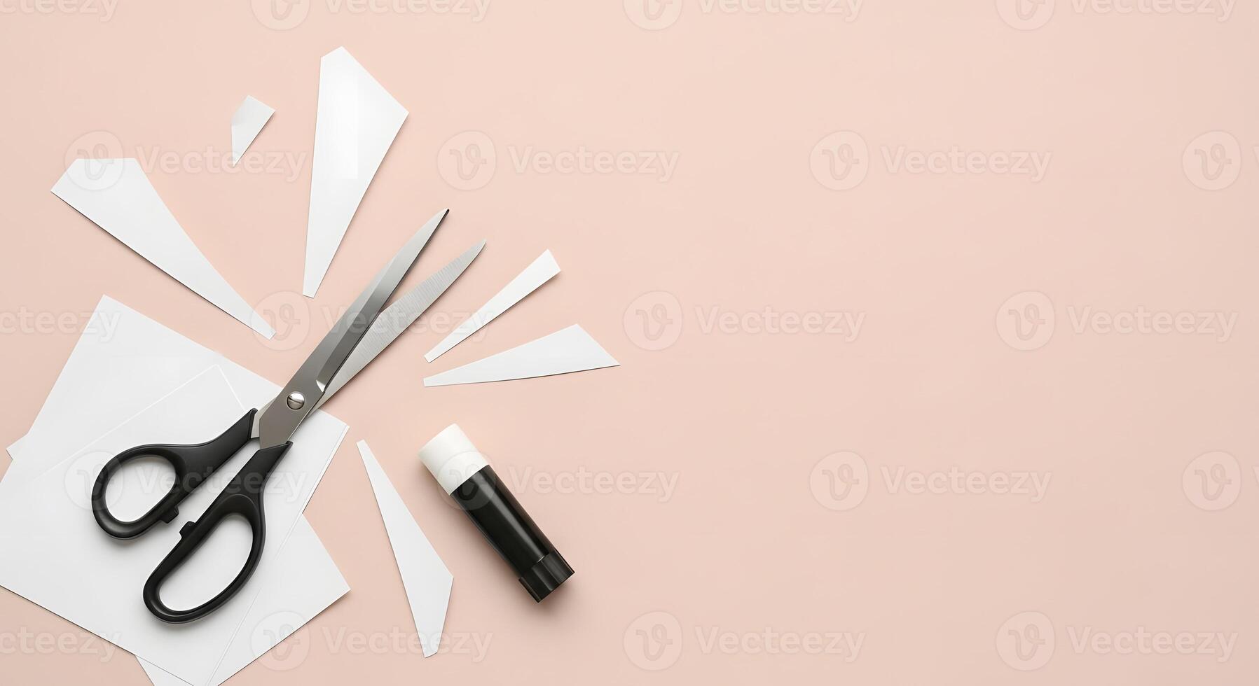 Scissors, paper and scissors on a pink background photo
