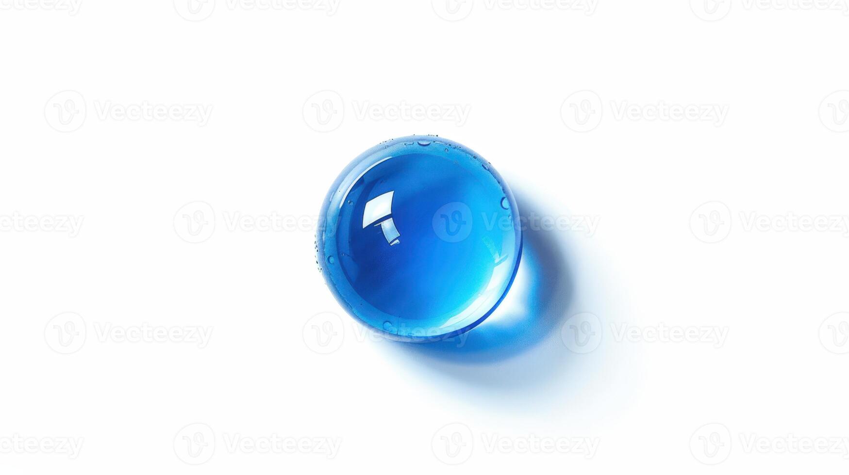 A blue glass ball on a white surface. photo