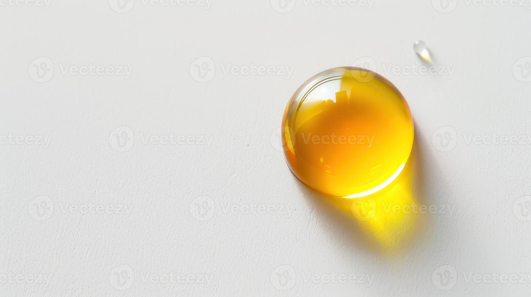 A drop of oil on a white surface photo