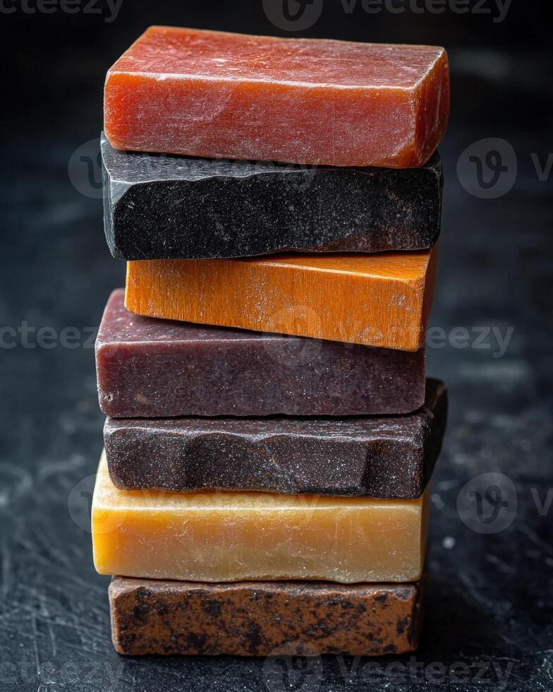 A stack of different colored soap bars photo