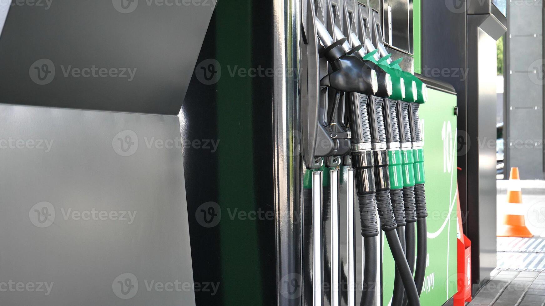 Angle View Of Petrol Column With Nozzles For Different Fuels photo