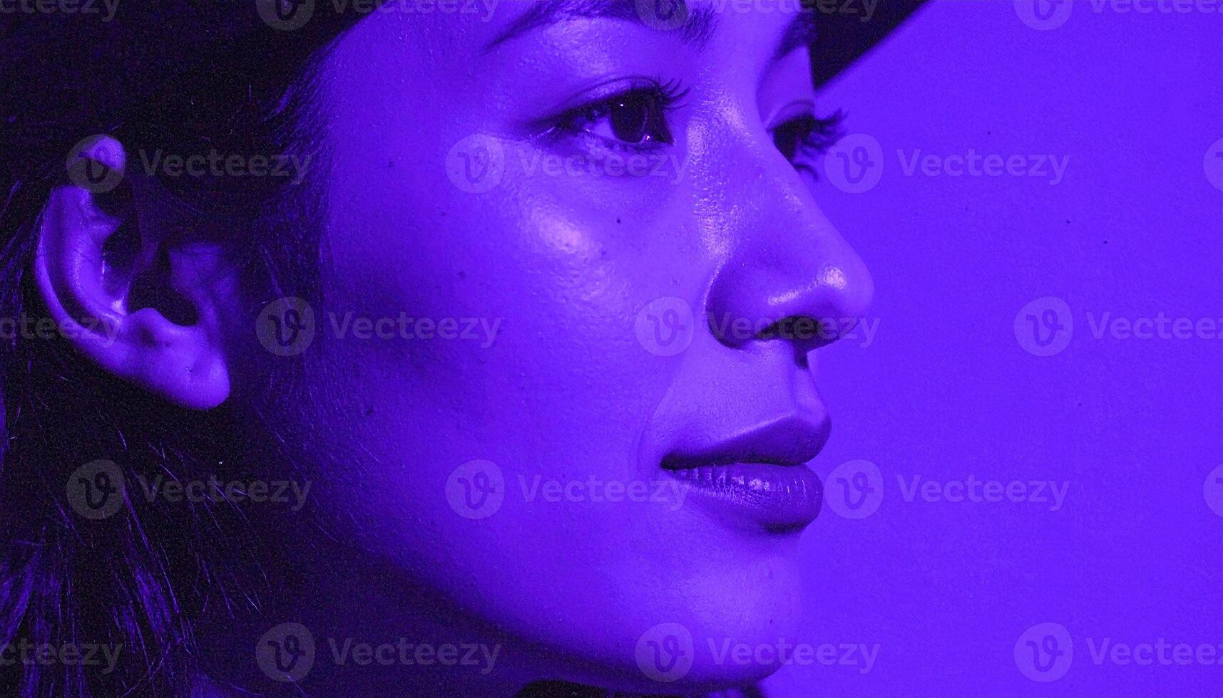 Serene Profile Portrait Illuminated by a Dreamy, Electric Purple Haze photo