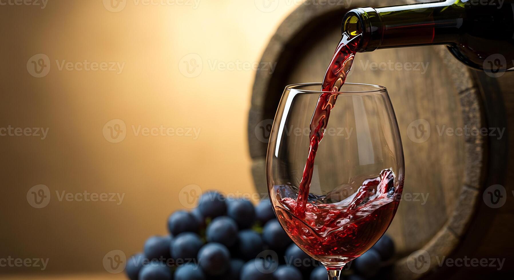 A stream of red wine fills a glass, featuring a wooden barrel and fresh grapes. photo