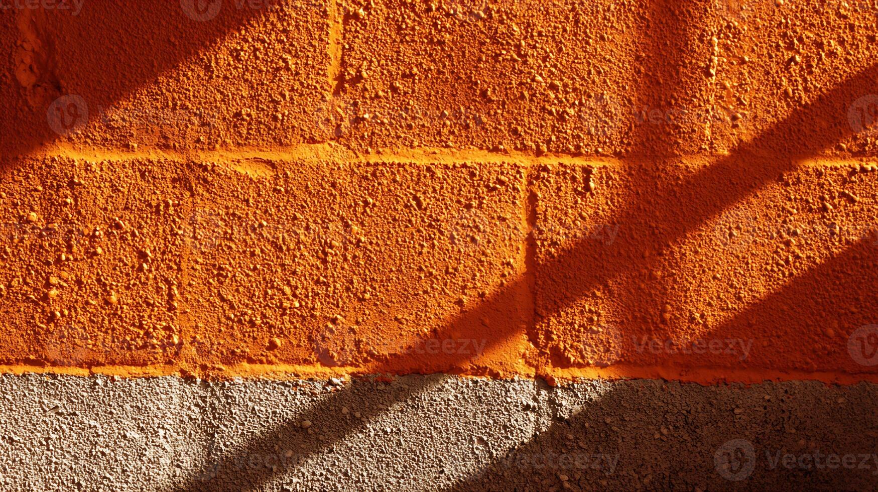 Rough orange and gray wall with diagonal shadows. Abstract textured background. photo