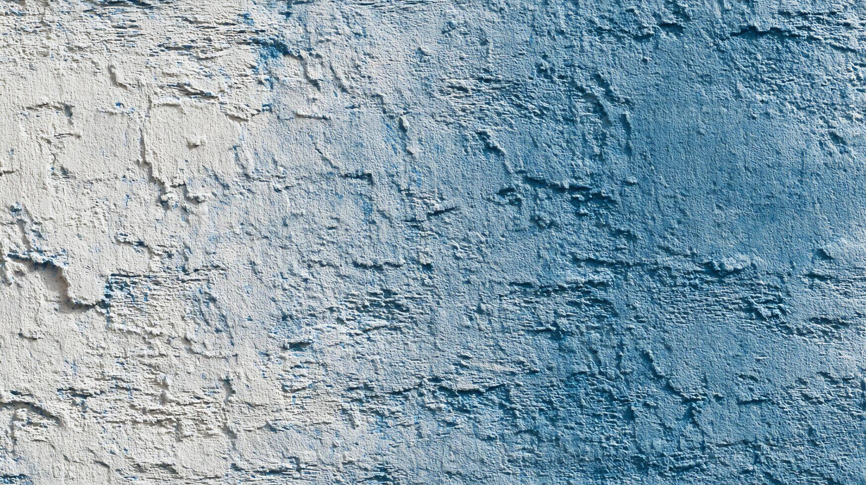 Close-up of blue and white textured wall. Rough stucco surface backdrop. photo