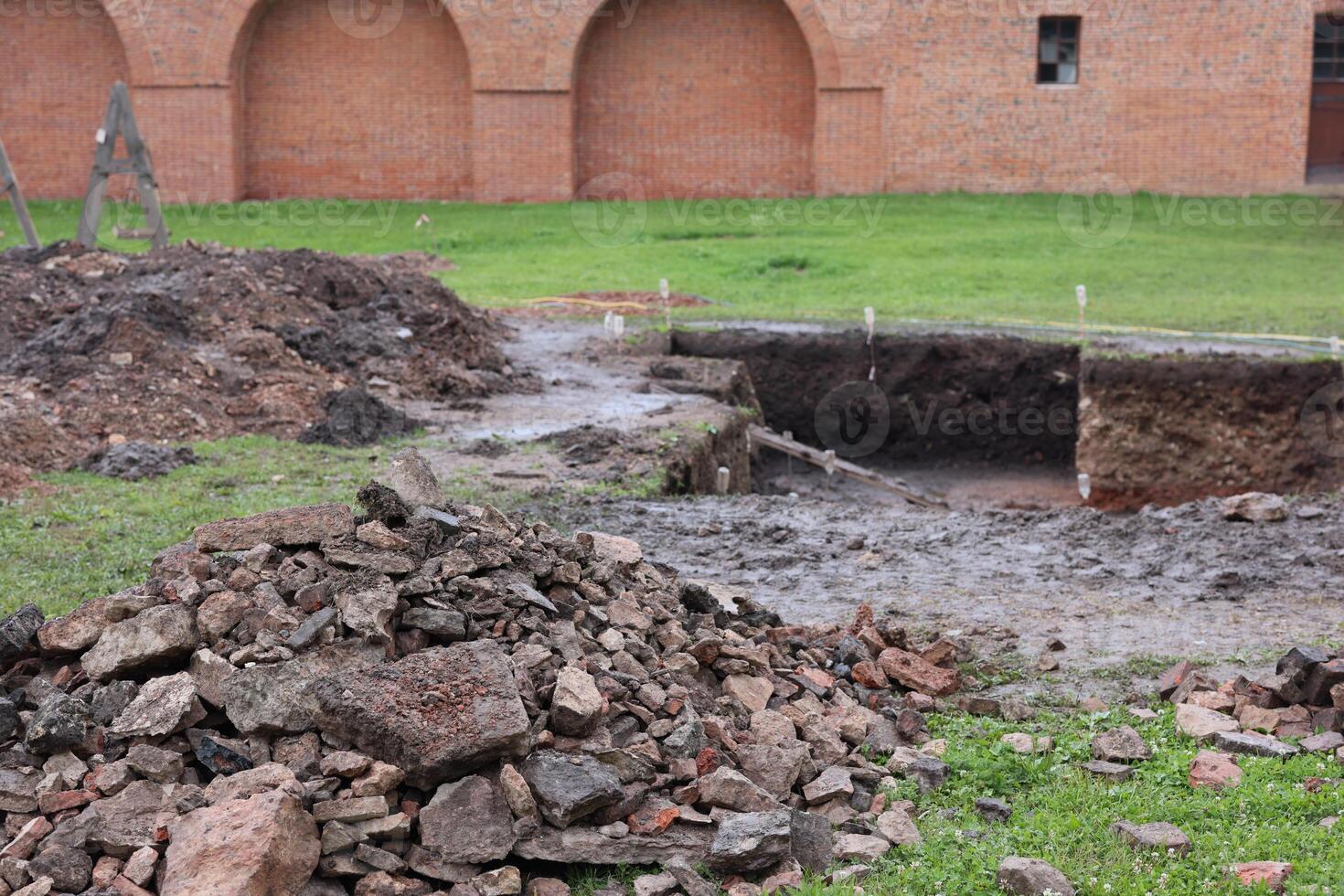 Excavation Site Featuring Unearthed Historical Materials and Remarkable Brick Structures photo
