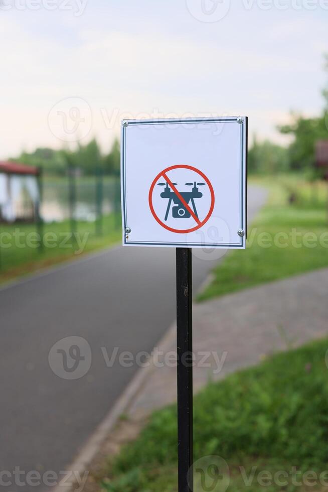 Sign Indicating a No Drone Zone Located Adjacent to the Waterway for Safety and Regulations photo