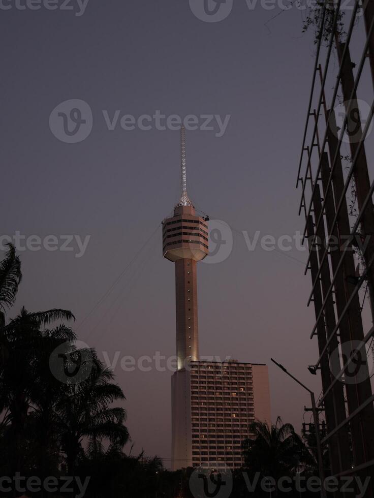 The Iconic Tower at Dusk Features an Urban Backdrop That Captivates All Who See It photo