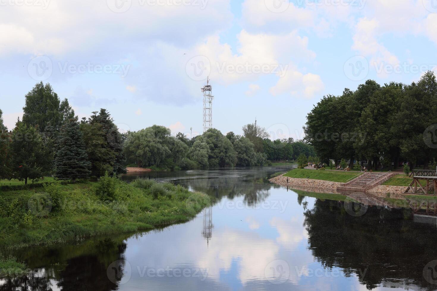 A Serene River Landscape Capturing the Beautiful Tower Reflections in Natures Calm photo