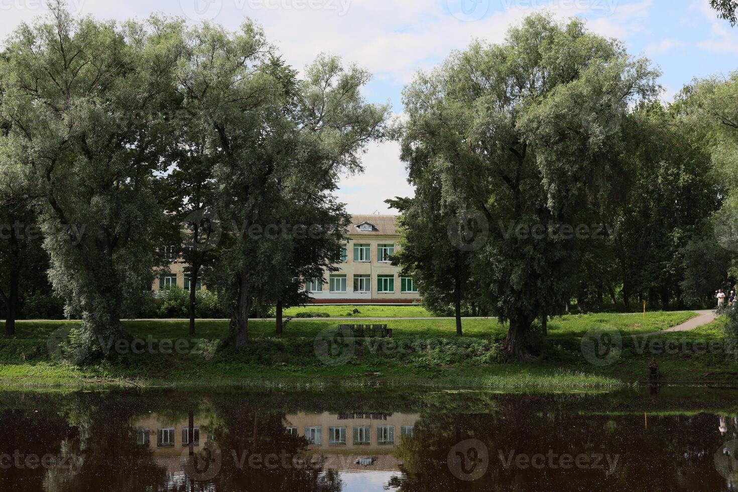 Serene Reflections of a Grand Historic Building by the Gentle Flowing River Nearby photo