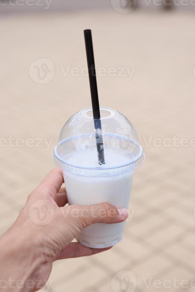 Enjoying a Refreshing Beverage in Hand While Relaxing on a Beautiful Sunny Day Outside photo