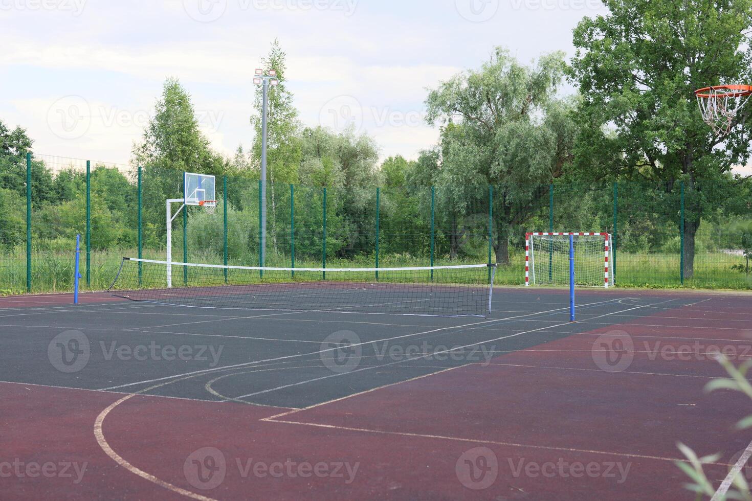 A Welcoming Outdoor Basketball and Handball Court Nestled in Beautiful, Natural Surroundings photo