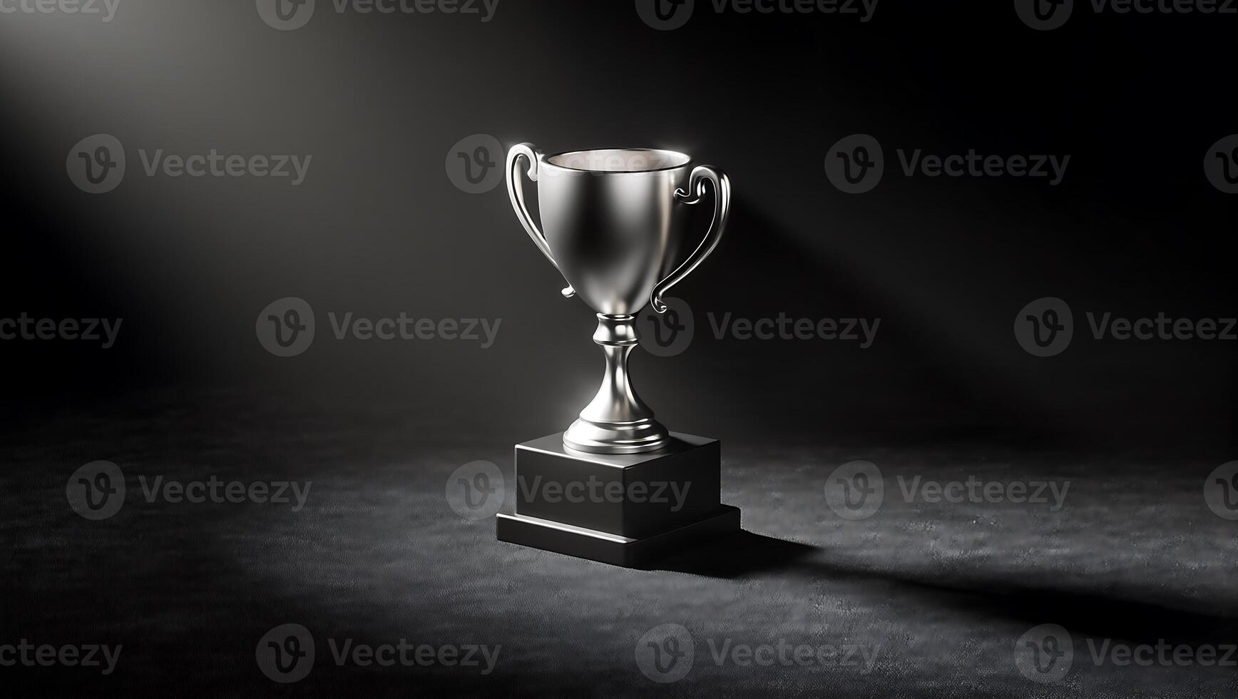 Trophy in Spotlight, A gleaming silver trophy, perched on a black base, stands majestically in a dramatic spotlight against a dark background. The image evokes feelings of success, achievement photo