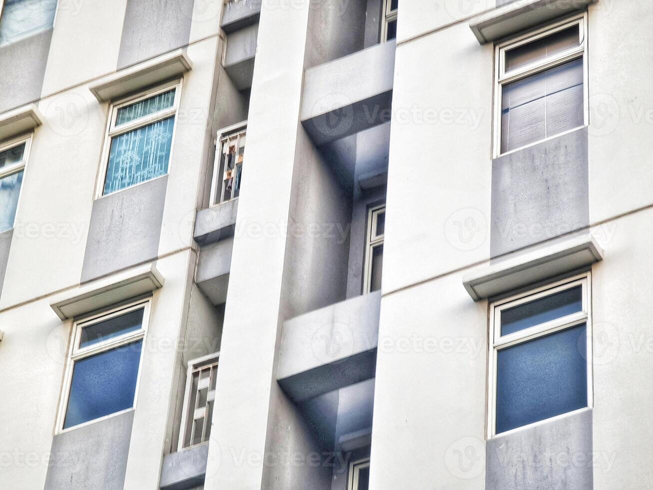 Apartment Building Exterior Featuring Windows and Architectural Details photo