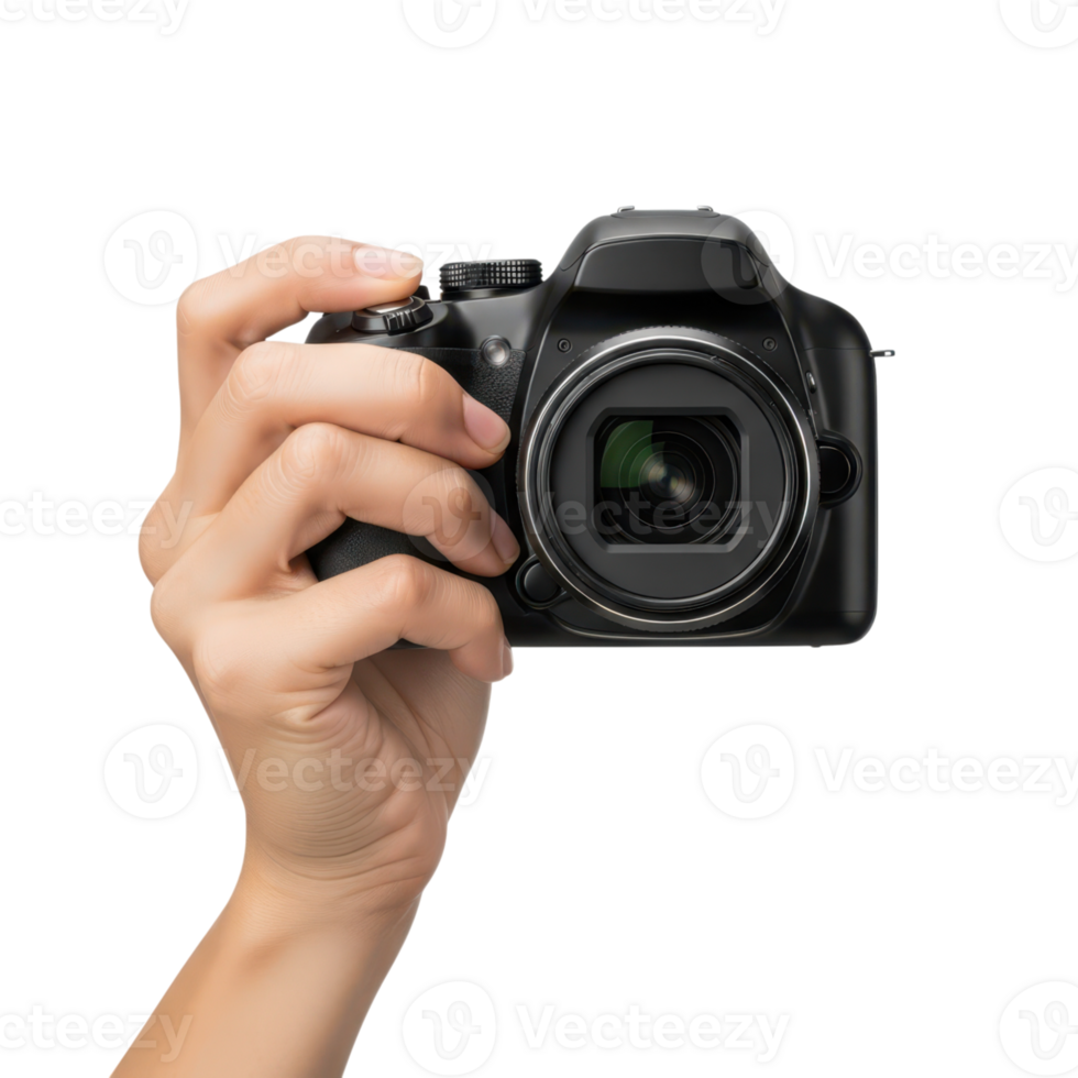 A persons hand firmly grips a black digital dslr camera ready to capture a png