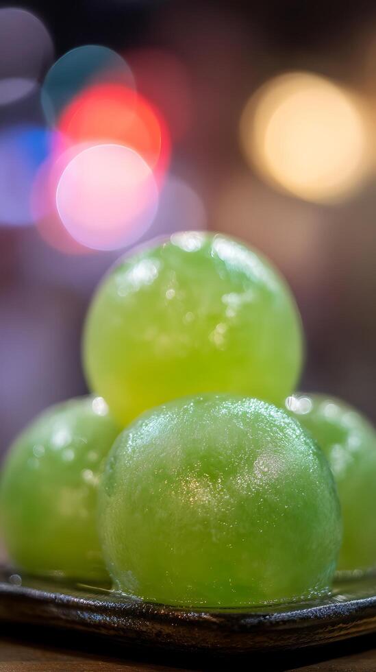 Refreshing Green Spheres with Soft Bokeh Lights Background. photo