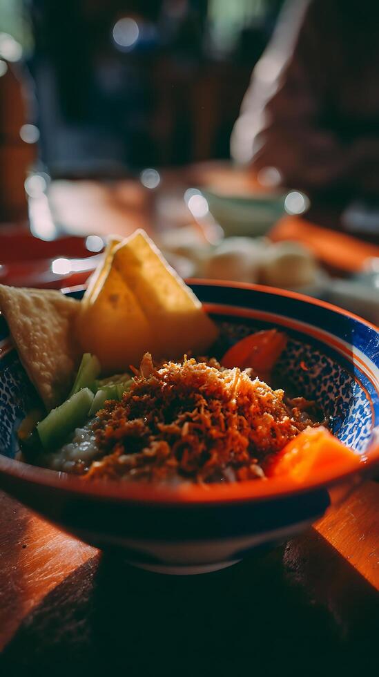 Delicious Asian Rice Porridge Served with Crispy Toppings and Crackers. photo