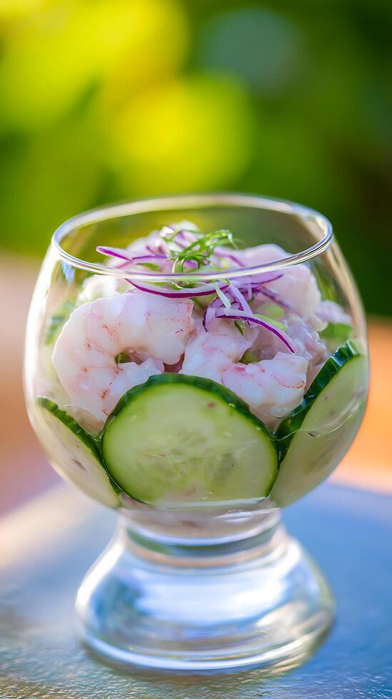 Fresh Shrimp Cocktail with Cucumber and Red Onion in a Glass. photo