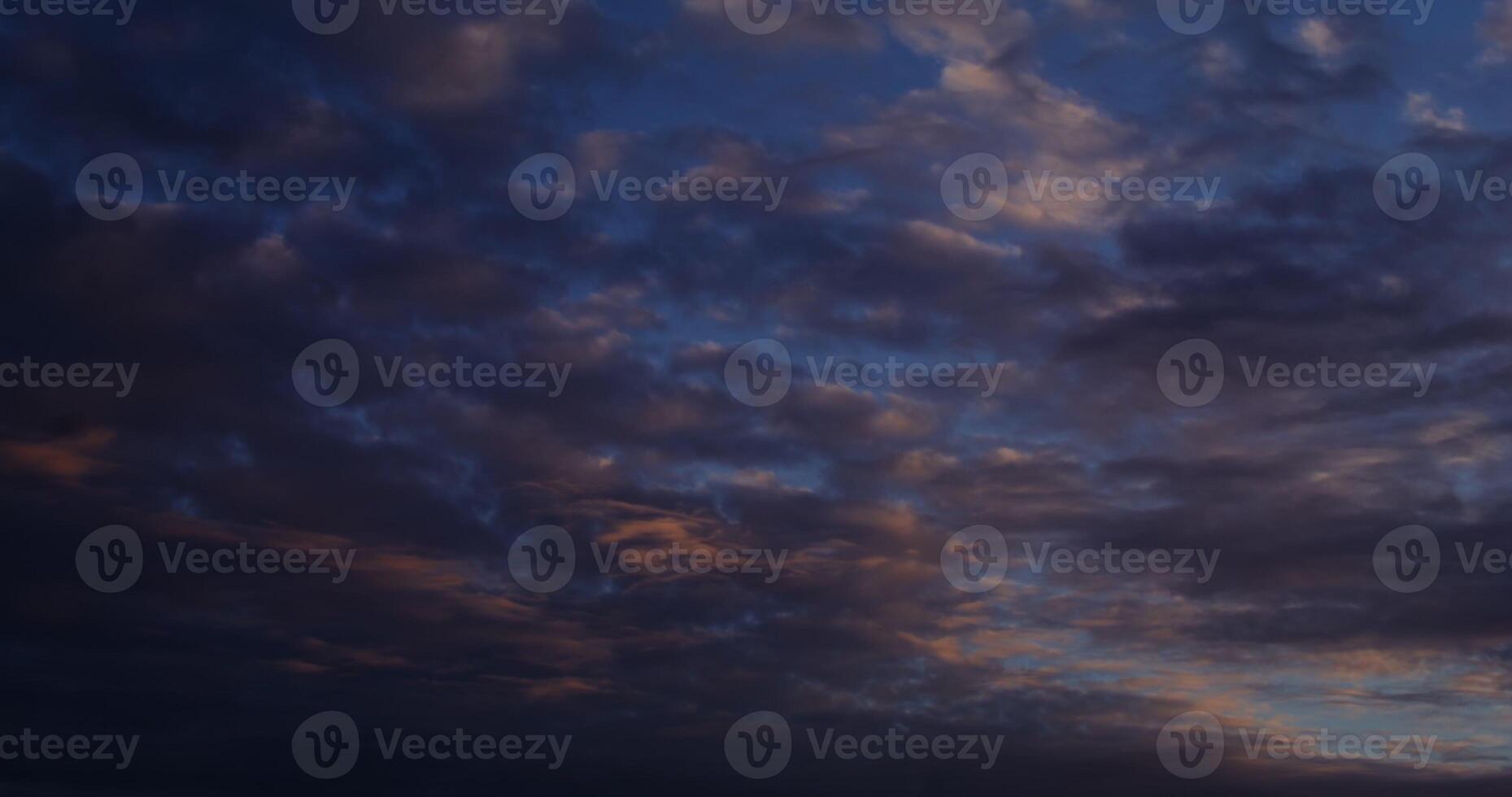 A plane flying in the sky with clouds photo