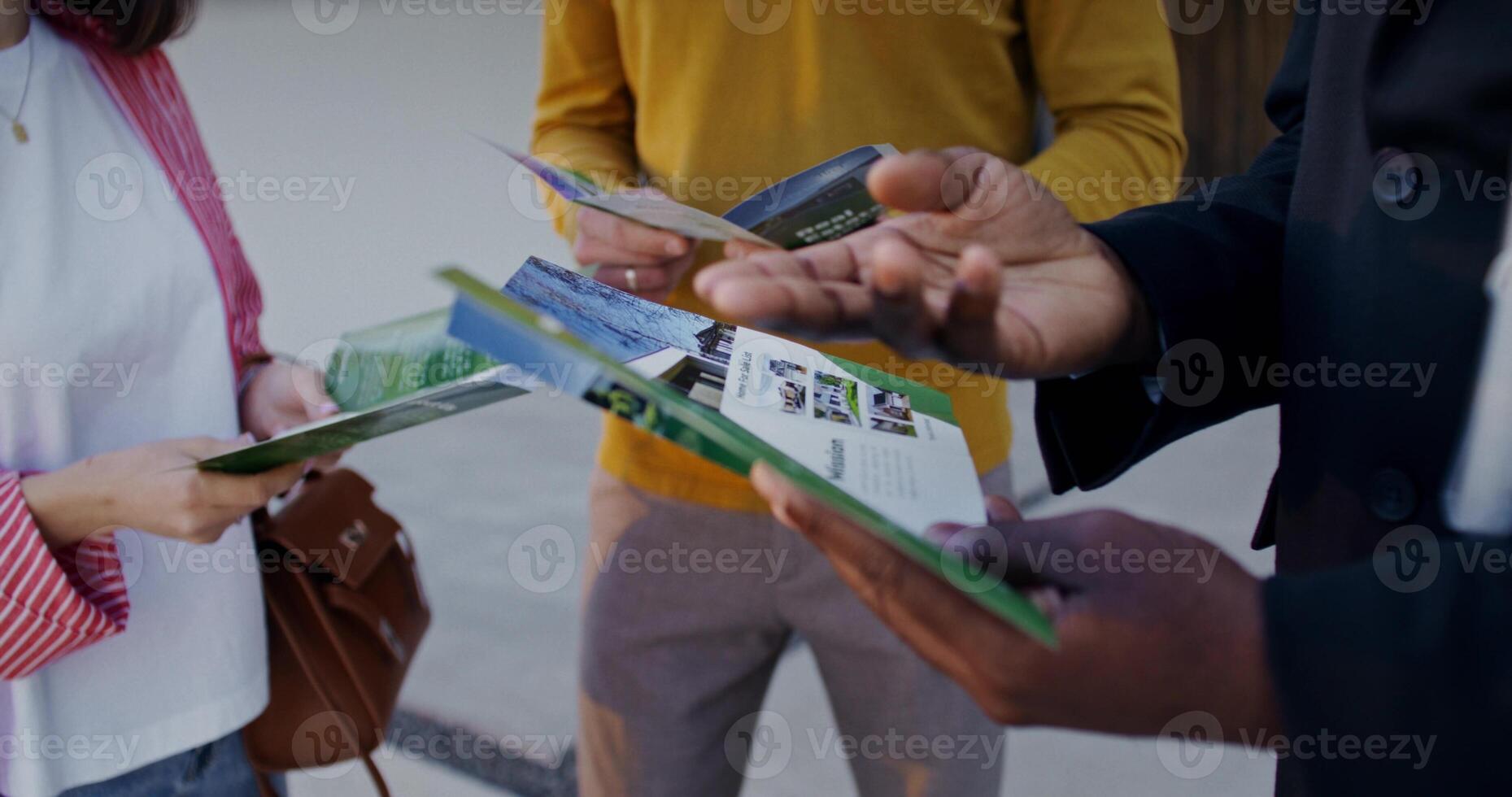 People looking at a brochure in a store photo