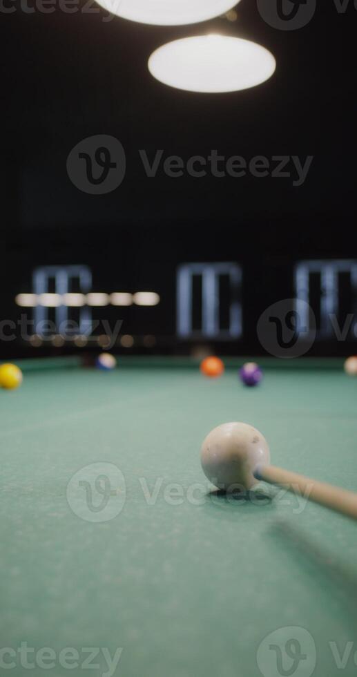 A billiard stick on a pool table photo