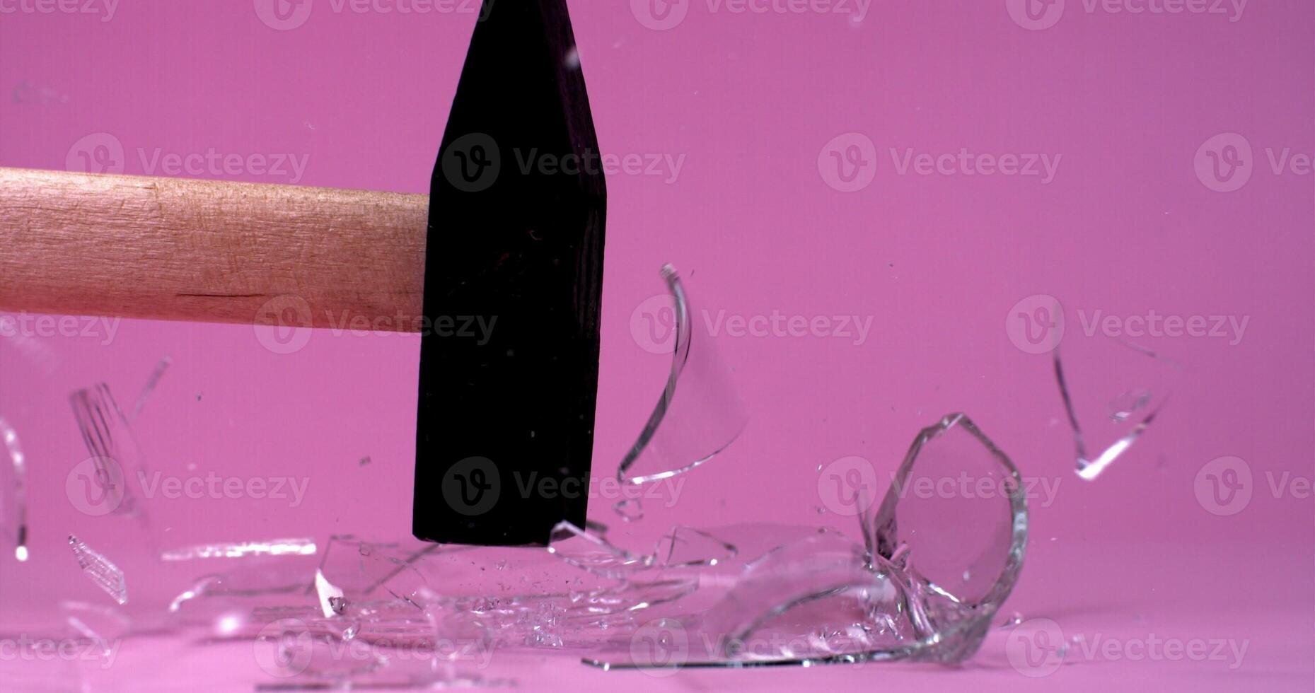 A hammer is being broken by a broken glass photo
