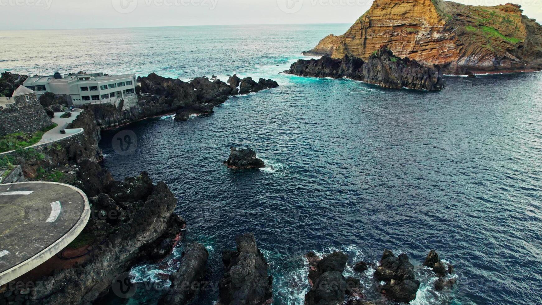 The view from the top of a cliff overlooking the ocean photo