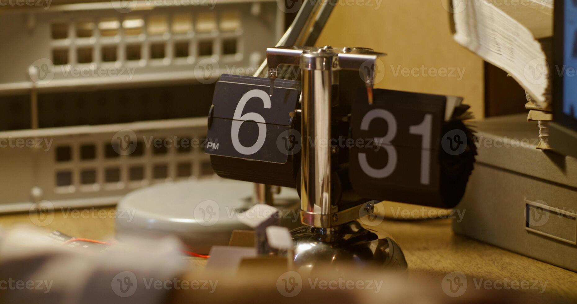 A desk with a clock on it photo