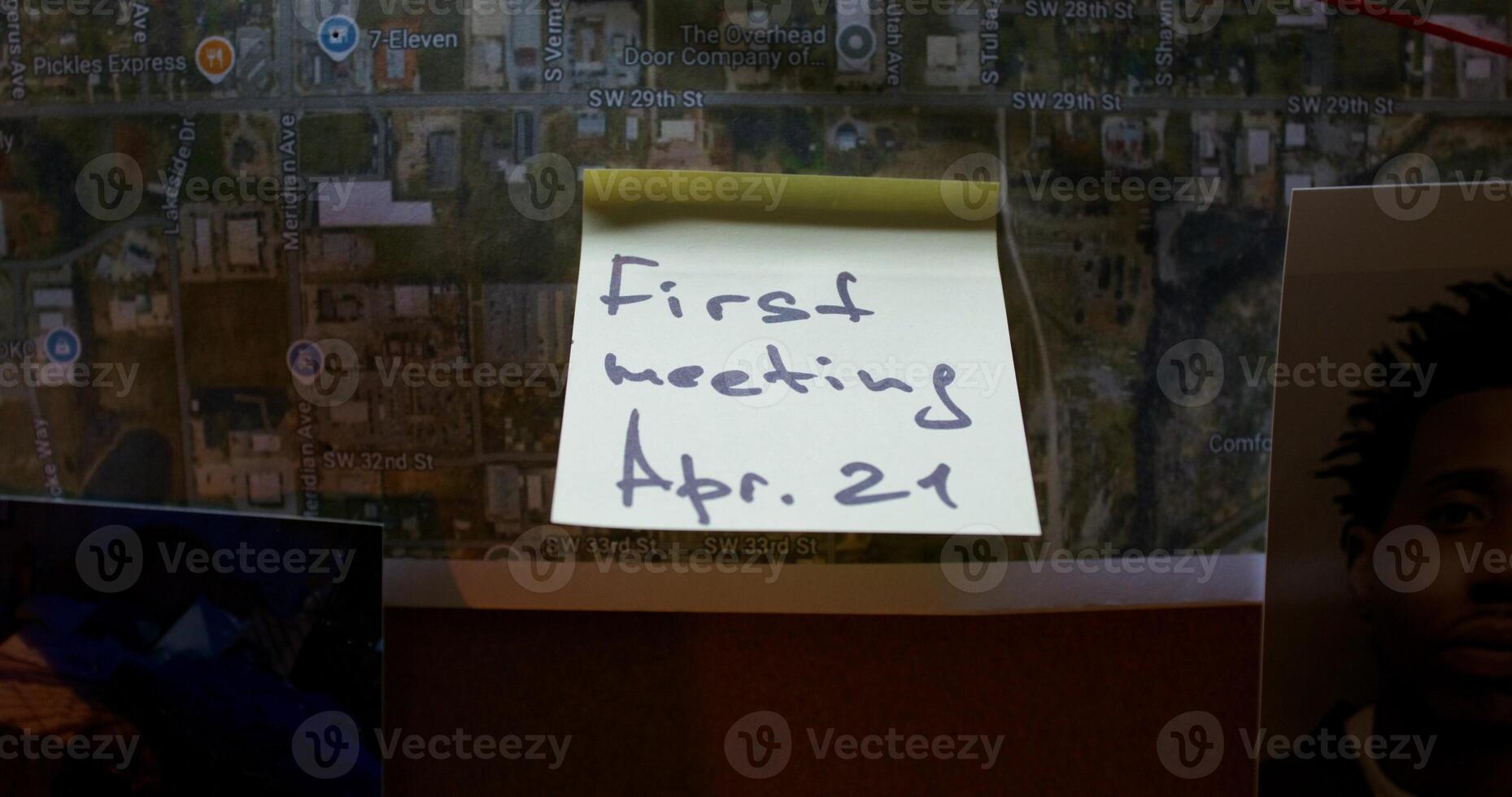 A post-it note with a map and a picture of a person photo