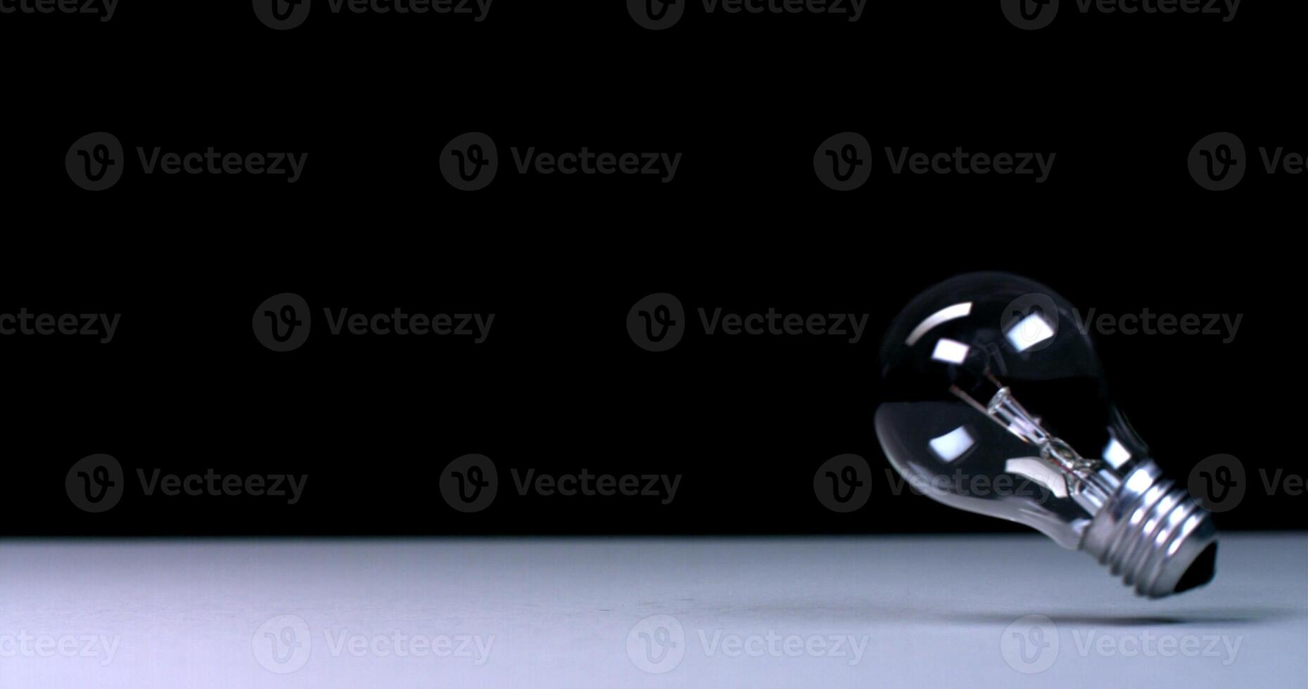 A light bulb is shown on a table photo