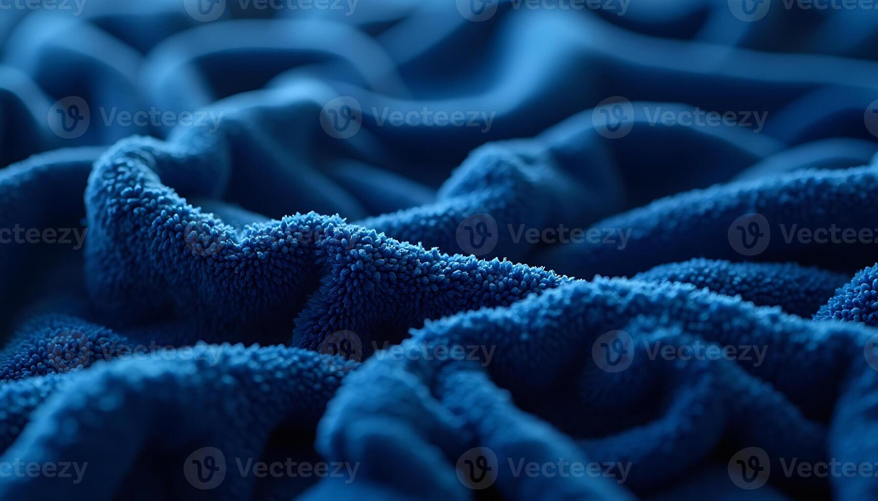 Close-up of Soft Blue Towel Texture with Deep Folds and Shadows photo
