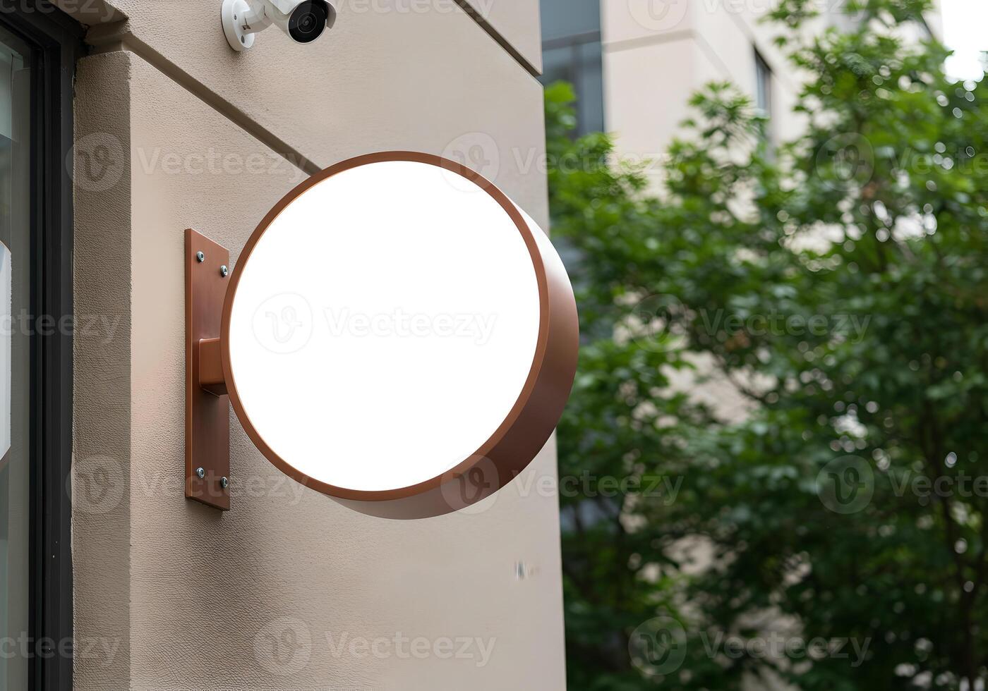 Logo Mockup on a Round Exterior Sign Mounted on the Wall photo