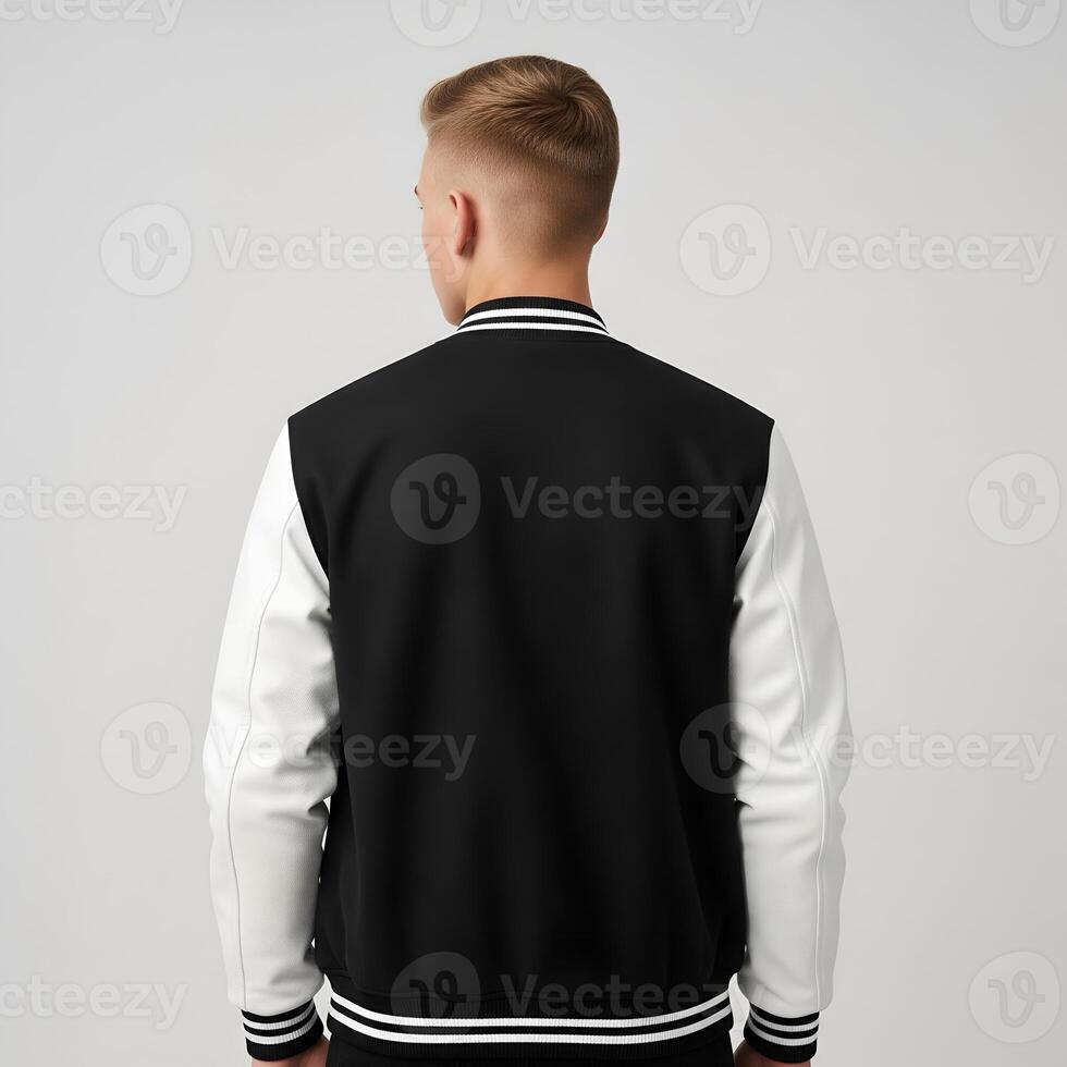 Rear View of a Man Wearing a Stylish Black and White Jacket for Design Mockup 1 photo