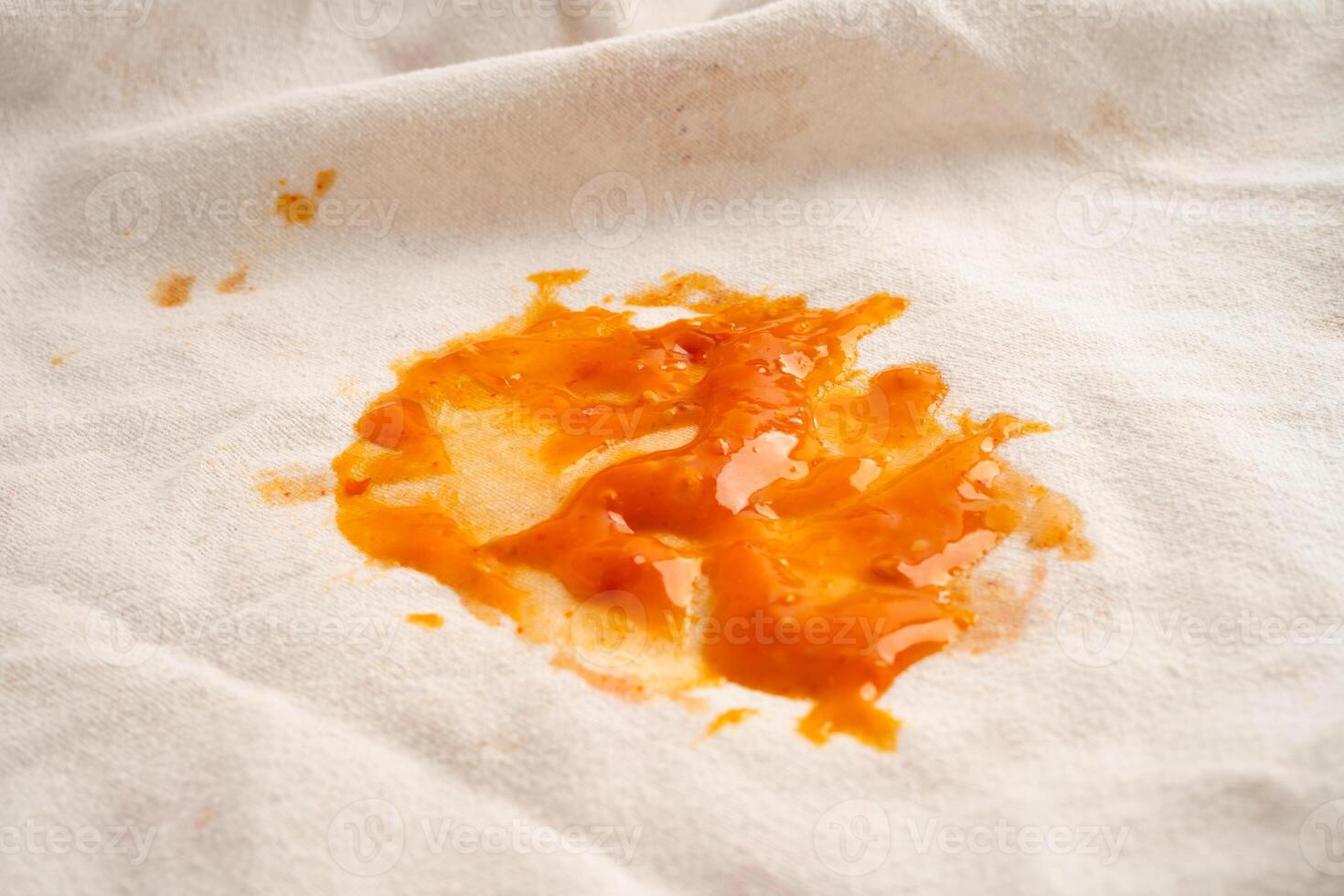 Dirty tomato sauce stain or ketchup on cloth. photo