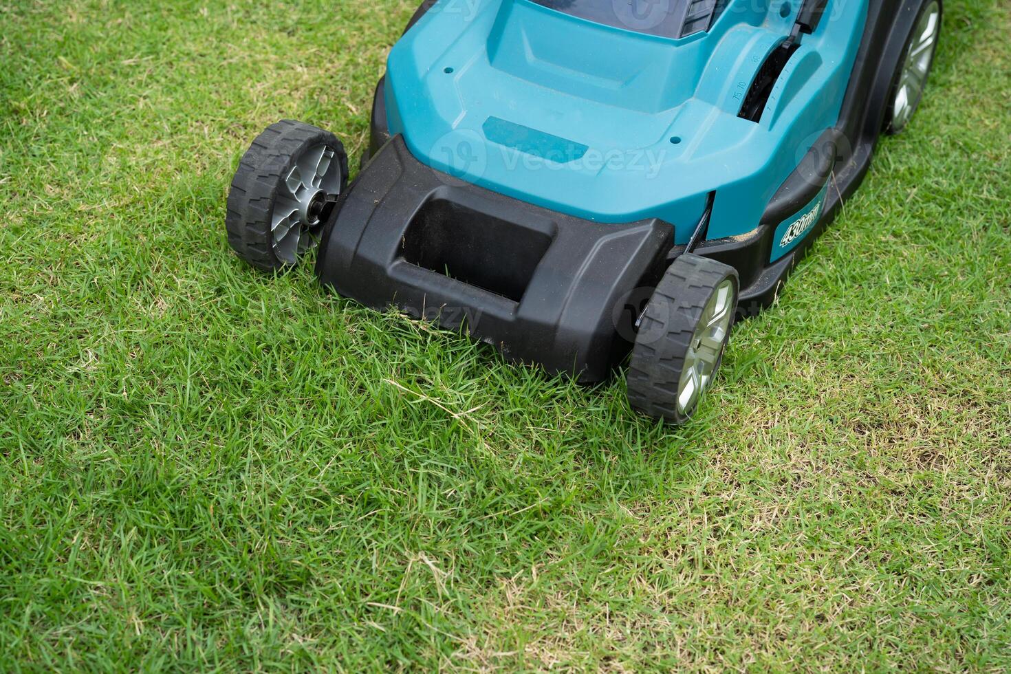 Lawn mover machine cut green grass, Hobby planting garden. photo
